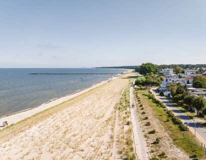 Two cyclists drive along the beach in Lubmin, shown from a bird&#39;s eye view